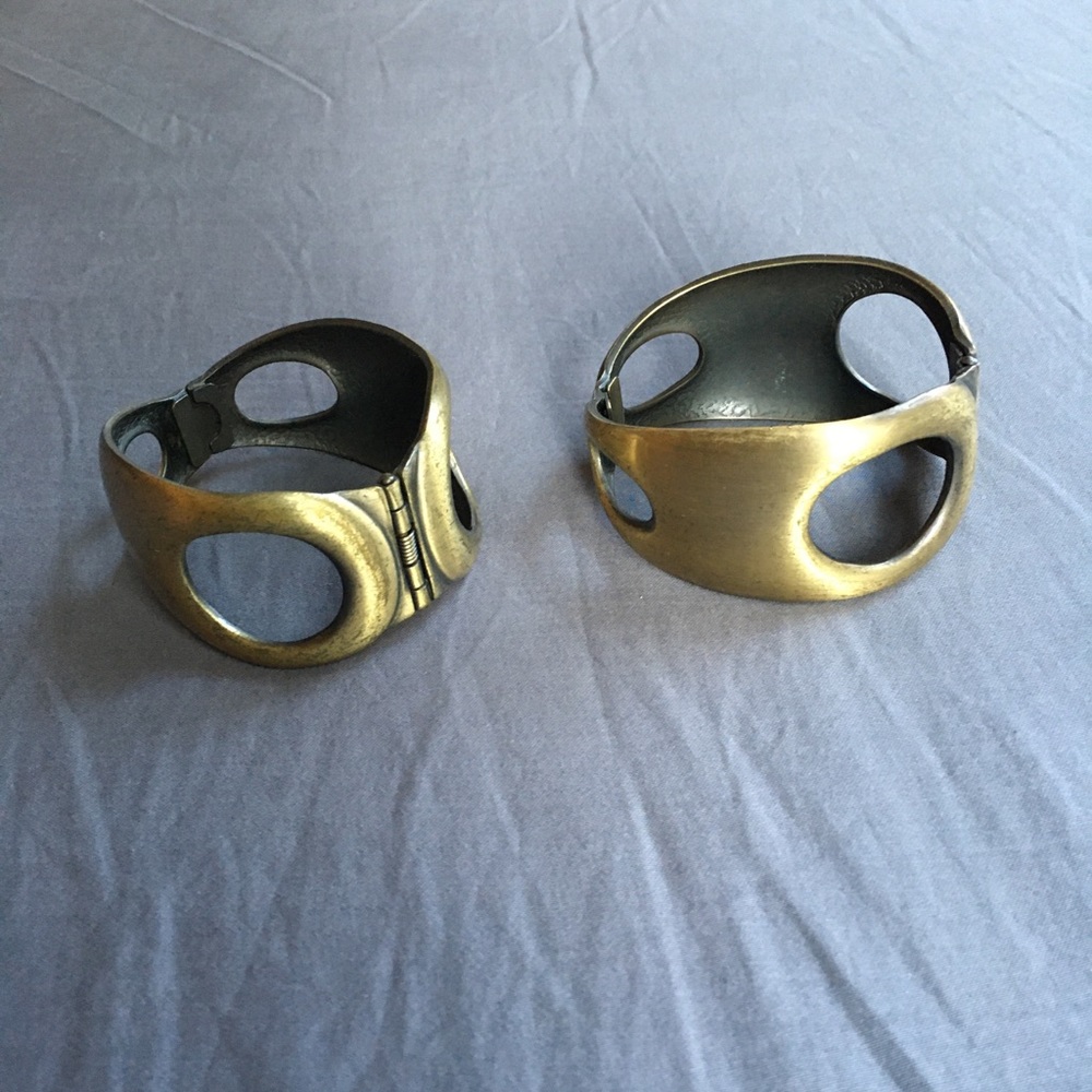 Gold metal bracelets.